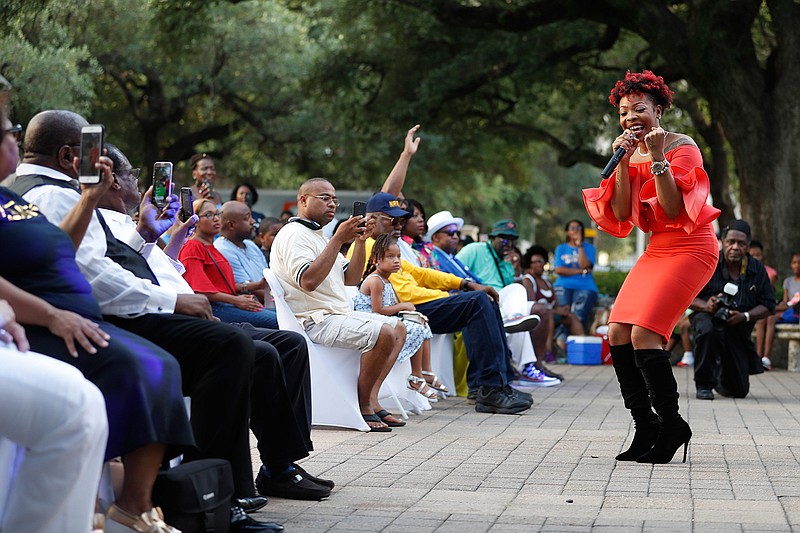 In this Sunday, July 1, 2018 photo, Alexis Spight sings to the audience during the Centennial Gospel Sunday Extravaganza as the NAACP Houston chapter celebrated its 100th anniversary at City Hall in Houston. ( Karen Warren\/Houston Chronicle via AP)