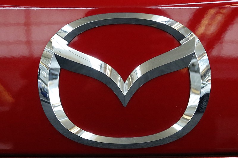 FILE- This Feb. 15, 2018, file photo shows the Mazda logo on the trunk of a Mazda vehicle on display at the Pittsburgh Auto Show. Mazda is recalling nearly 270,000 vehicles with Takata airbags that have the potential to explode. A potentially deadly defect can be found in passenger-side airbags on certain 2003-2008 Mazda6, 2006-2007 Mazdaspeed6 and 2004 MPV vehicles nationwide. It also involves 2005-2006 MPV models in certain states. (AP Photo/Gene J. Puskar, File)