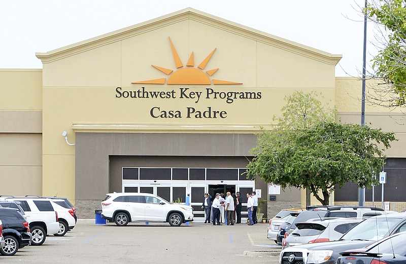 FILE - In this June 18, 2018 file photo, dignitaries take a tour of Southwest Key Programs Casa Padre, a U.S. immigration facility in Brownsville, Texas, where children who have been separated from their families are detained. The American Civil Liberties Union says it appears the Trump administration will miss a Tuesday, July 10 deadline to reunite young children with their parents in more than half of the cases. The group said the administration provided it with a list of 102 children under 5 years old who must be reunited by Tuesday under an order by U.S. District Judge Dana Sabraw in San Diego. It said in a statement that it “appears likely that less than half will be reunited” by that deadline.   (Miguel Roberts /The Brownsville Herald via AP, File)