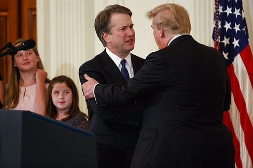 President Donald Trump shakes hands with Brett Kavanaugh, his Supreme Court nominee, in the East Room of the White House, Monday, July 9, 2018, in Washington. (AP Photo/Evan Vucci)