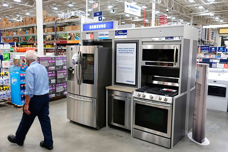In this May 21, 2018, file photo, kitchen appliances for sale at at Lowe's Home Improvement store in East Rutherford, N.J. Home improvements can rejuvenate a stale dwelling. You don't have to revamp every inch of a room. Dan DiClerico, a home expert at HomeAdvisor.suggests that you "splurge on the things you're interacting with on a daily basis." (AP Photo/Ted Shaffrey, File)