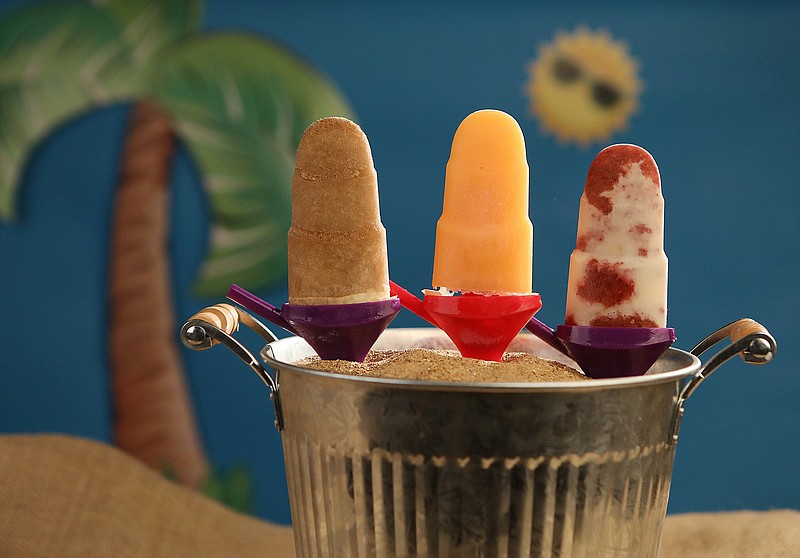 Homemade popsicles cool you down on a hot day. They are from left: Root Beer Float Popsicle, Cantaloupe Popsicle and Roasted Strawberries and Cream Popsicle. (J.B. Forbes/St. Louis Post-Dispatch/TNS) 