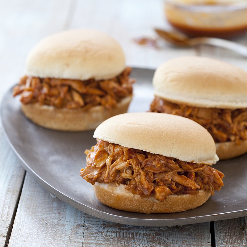 This undated photo provided by America's Test Kitchen in June 2018 shows barbecued pulled chicken sandwiches in Brookline, Mass. This recipe appears in the "The Complete Cook's Country TV Cookbook, 10th Anniversary Edition." (Joe Keller/America's Test Kitchen via AP)
