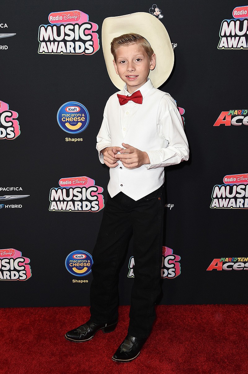 Mason Ramsey attends the 2018 Radio Disney Music Awards on June 22 at Loews Hotel in Los Angeles. Ramsey, a preteen Illinois boy who went viral online in a video of him singing and yodeling in a Walmart store, is releasing his first album July 20. (Photo by Richard Shotwell/Invision/AP, File)