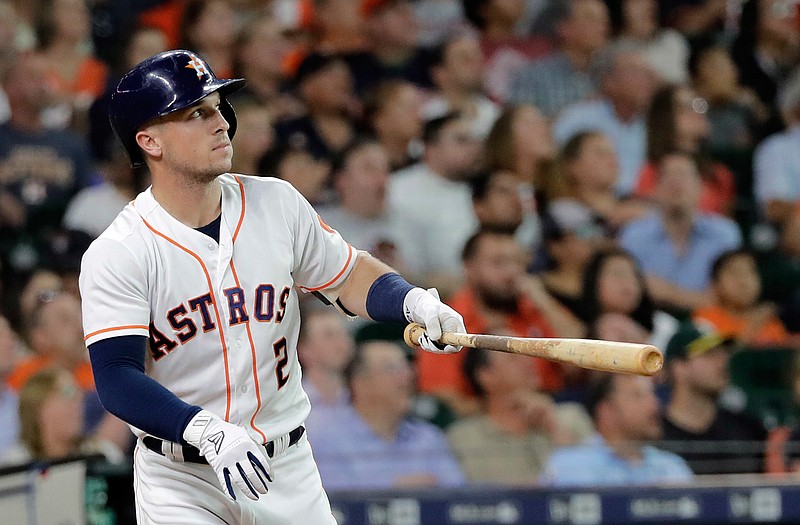 Houston Astros' Alex Bregman watches his home run against the Oakland Athletics during the first inning of a baseball game Tuesday, July 10, 2018, in Houston. (AP Photo/David J. Phillip)