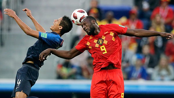 France's Raphael Varane (left) and Belgium's Romelu Lukaku vie for the ball during Tuesday's semifinal match in St. Petersburg, Russia.