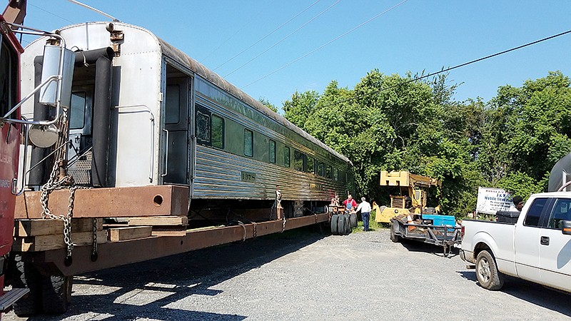 A vintage rail lounge car that will become a downtown diner awaits transport to its new home Thursday, July 12, 2018, at M&M Milling Inc. in Texarkana, Ark. As of Thursday afternoon, the car was slowly making its way down Highway 67/Broad Street to the spot where it will be set up at Front and Olive streets. Owner David Peavy plans to call the restaurant The Flying Crow after a Kansas City Southern train that once traveled through Texarkana. Pullman-Standard built the car around 1940.