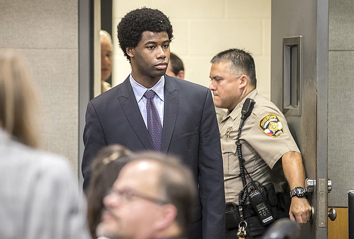 Meechaiel Criner, accused of killing University of Texas student Haruka Weiser in April 2016, is escorted into a courtroom, Wednesday, July 11, 2018 in Austin, Texas. Criner, a 17-year-old foster care runaway at the time of the killing, is on trial for capital murder. He faces a sentence of life in prison if convicted. 