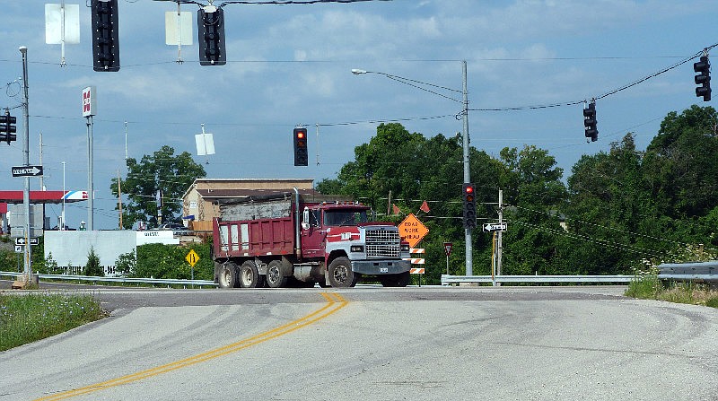 The Missouri Department of Transportation plans to restructure the U.S. Highway 54 and state Route W intersection, shown above, into an interchange thereby eliminating the need for a traffic signal. (July 2014 file photo)