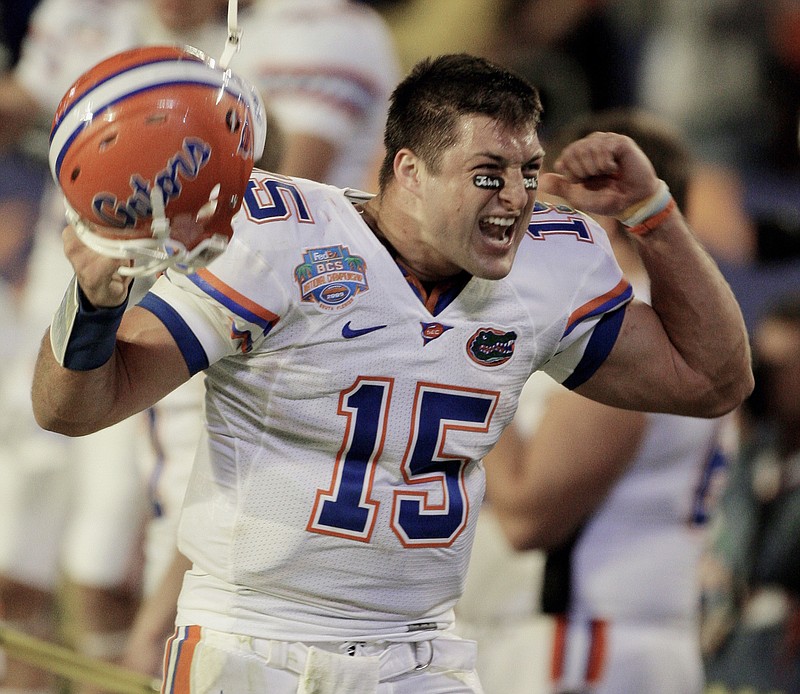In this Jan. 8, 2009, file photo, Florida's Tim Tebow celebrates during the fourth quarter of the BCS Championship NCAA college football game against Oklahoma, in Miami. Two-time national champion and 2007 Heisman Trophy winner Tim Tebow will be inducted into the team's ring of honor, becoming the sixth player to receive the honor. The school announced Wednesday, July 11, 2018, that Tebow will be recognized during the LSU-Florida game on Oct. 6, 2018. (AP Photo/Mark Humphrey, File)