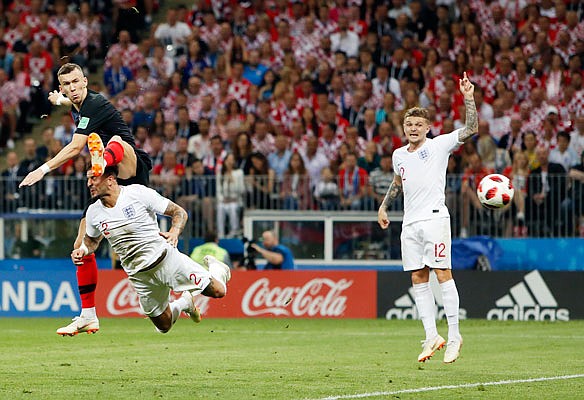 Ivan Perisic of Croatia watches his shot go toward the net during Wednesday's match against England in Moscow. Perisic scored on the play.