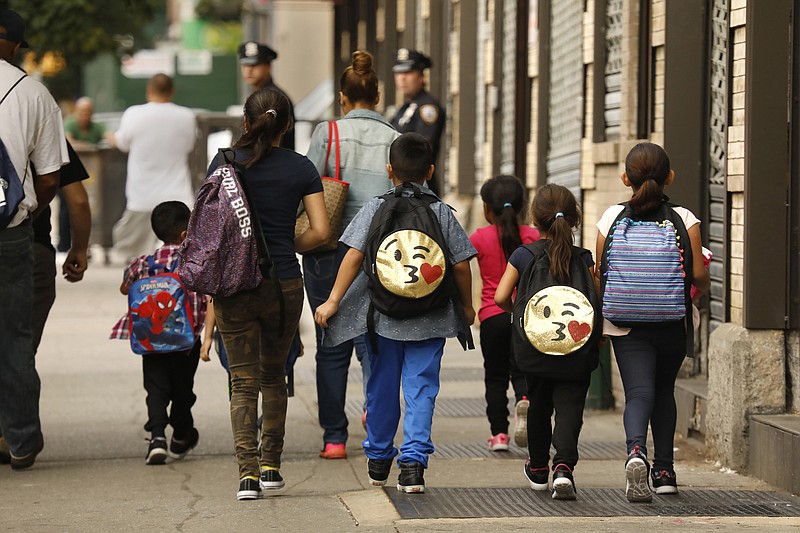  A group of children are taken to the Cayuga Center in East Harlem, on June 27, 2018. Hundreds of migrant children separated from their parents by federal immigration officials are being cared for in the facility. (Carolyn Cole /Los Angeles Times/TNS)