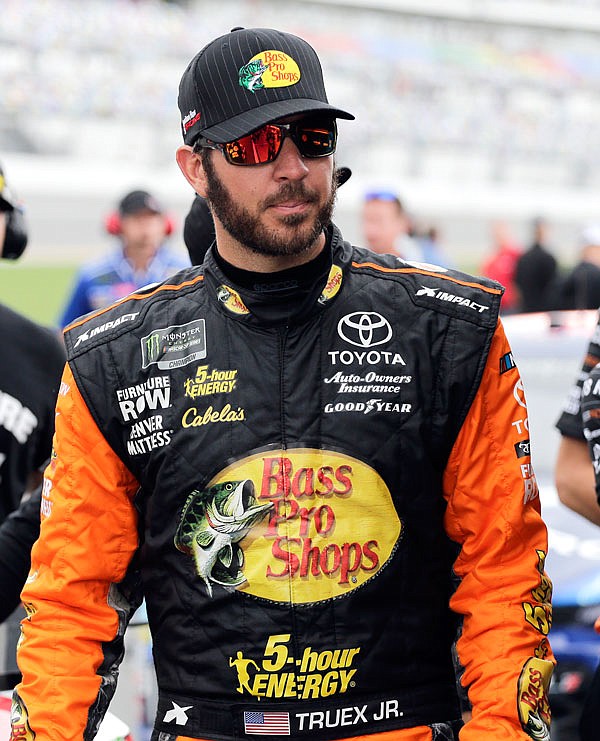 Martin Truex Jr. walks to his car on pit road during last week's qualifying for the NASCAR Cup Series race at Daytona International Speedway in Daytona Beach, Fla.