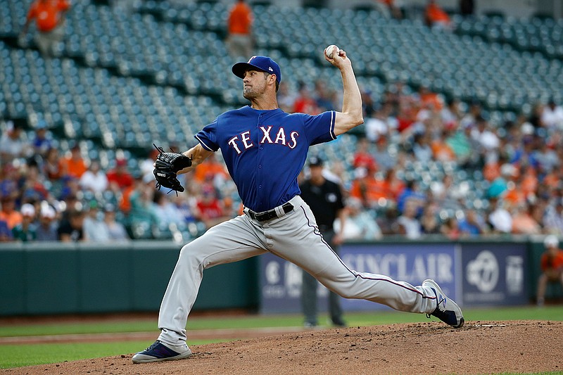 Texas Rangers starting pitcher Cole Hamels throws to the Baltimore Orioles in the first inning of a baseball game, Friday, July 13, 2018, in Baltimore. (AP Photo/Patrick Semansky)