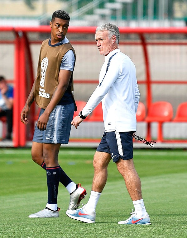 France coach Didier Deschamps watches his players exercising Saturday during the team's official training on the eve of the World Cup final match against Croatia in Moscow.