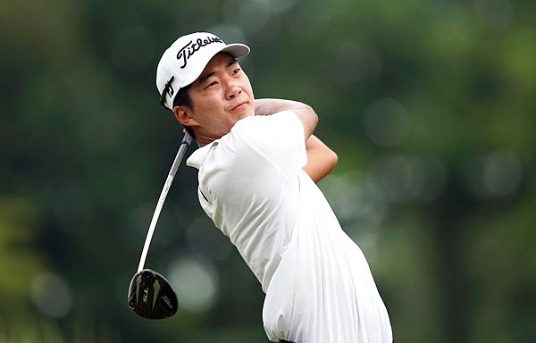 Michael Kim hits off the ninth tee during Saturday's third round of the John Deere Classic at TPC Deere Run in Silvis, Ill.