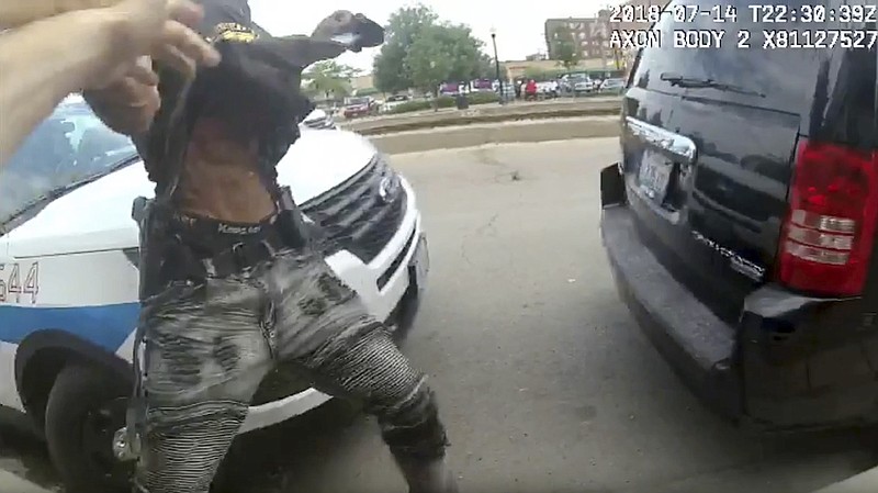 This frame grab from police body cam video provided by the Chicago Police Department shows authorities trying to apprehend a suspect who appeared to be armed, Saturday, July 14, 2018, in Chicago. The suspect was fatally shot by police during the confrontation. (Chicago Police Department via AP)