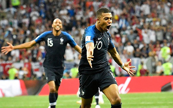 France's Kylian Mbappe (front) celebrates after scoring his team's fourth goal during Sunday's World Cup final match against Croatia at the Luzhniki Stadium in Moscow.