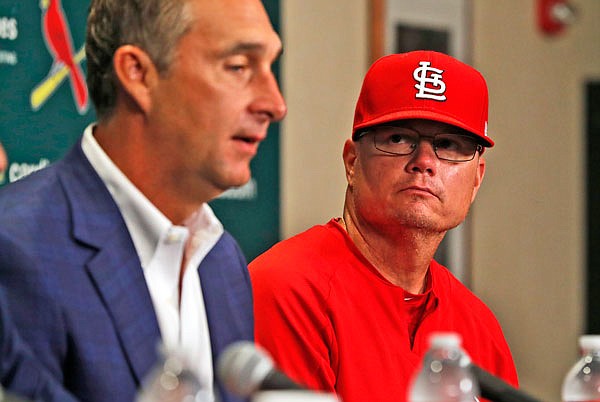 Cardinals president of baseball operations John Mozeliak (left) speaks about the firing of Cardinals manager Mike Matheny as interim manager Mike Shildt listens during a press conference before Sunday's game against Reds in St. Louis.