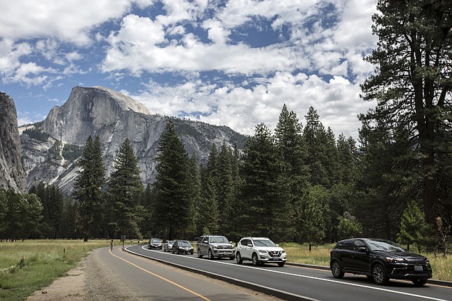 Traffic backs up along the valley floor at Yosemite National Park on July 16, 2017. A firefighter was killed on Saturday, July 14, 2018, while battling a wildfire in the nearby Sierra National Forest. (Brian vander Brug/Los Angeles Times//TNS)