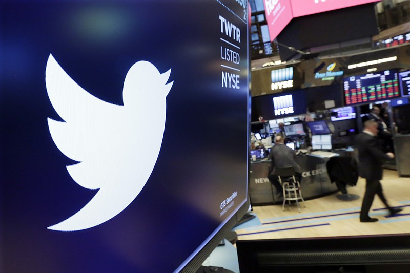 FILE - In this Feb. 8, 2018 file photo, the logo for Twitter is displayed above a trading post on the floor of the New York Stock Exchange.  Twitter suspended at least 58 million user accounts in the final three months of 2017, according to data obtained by The Associated Press. The figure highlights the company’s newly aggressive stance against malicious or suspicious accounts in the wake of Russian disinformation efforts during the 2016 U.S. presidential campaign.  (AP Photo/Richard Drew, File)