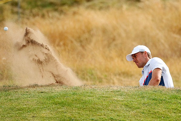 Jordan Spieth plays out of the bunker on the 14th hole during Monday's practice round for the 147th British Open Championship at Carnoustie, Scotland.