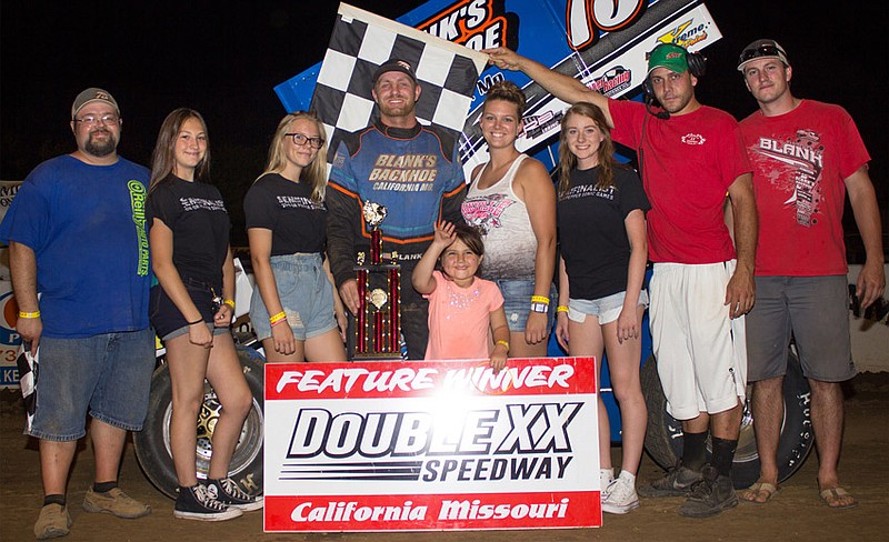 California's own Tyler Blank accepts 'Sonic Night' 350 winged sprint feature trophy from three California Sonic representatives, as well as little Reighlynn Wyatt.