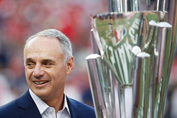 Major League Baseball commissioner Rob Manfred stands with trophy before the MLB Home Run Derby on Monday at Nationals Park in Washington.