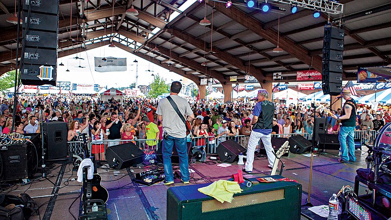 Festivalgoers listen to the band during the recent Mudbug Madness Festival in downtown Shreveport, La. The two-day festival began in 1984 and has grown into a four-day event steeped in Cajun music and food. (Photo courtesy of Jim Noetze)
