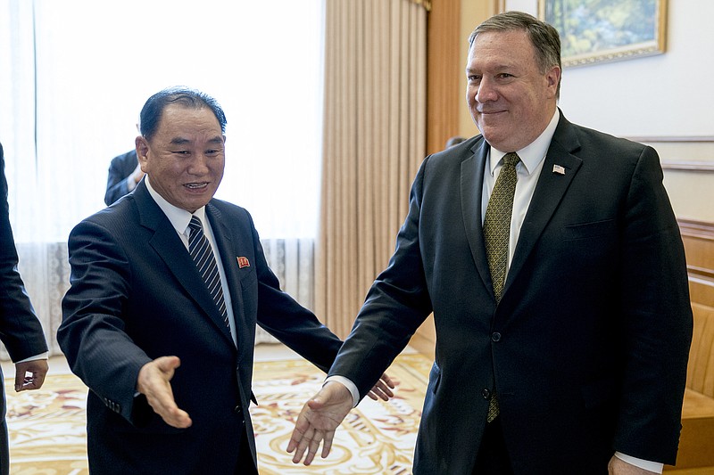 In this July 7, 2018, file photo, U.S. Secretary of State Mike Pompeo, right, and Kim Yong Chol, a North Korean senior ruling party official and former intelligence chief, arrive for a lunch at the Park Hwa Guest House in Pyongyang, North Korea. More than a month after North Korea pledged to immediately return some American war dead, the promise is unfulfilled. Pompeo, who traveled to Pyongyang earlier this month to press the North Koreans further, said Wednesday, July 18, the return could begin "in the next couple of weeks." (AP Photo/Andrew Harnik, Pool, File)