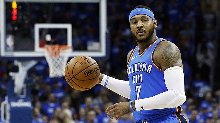 This is an April 25, 2018, file photo showing Oklahoma City Thunder forward Carmelo Anthony (7) during Game 5 of an NBA basketball first-round playoff series against the Utah Jazz, in Oklahoma City. Carmelo Anthony is done in Oklahoma City. A person with knowledge of the details tells The Associated Press the Thunder are sending the veteran NBA forward and a 2022 protected first-round pick to Atlanta in exchange for Hawks guard Dennis Schroder and Mike Muscala. 