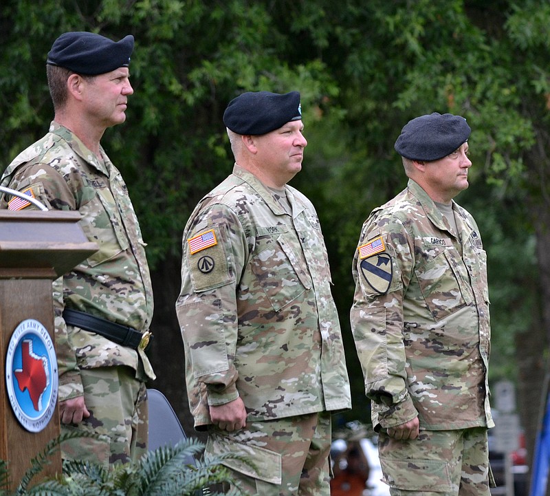 From left to right, Maj. Gen. Daniel G. Mitchell, commanding general of the U.S. Army Tank-Automotive and Armaments Command, officiates the change of command ceremony Wednesday at Red River Army Depot. Col. Stephen M. York (middle) is the incoming commander. Col. Jason A. Carrico is the outgoing commander, completing a two-year tour at RRAD. (Photo  courtesy of Mike Malone)
