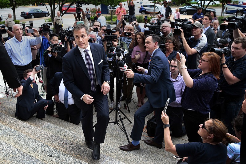 FILE - In this May 14, 2018 file photo, Gov. Eric Greitens leaves the civil courts building in St. Louis, Mo., after speaking with reporters after a felony invasion-of-privacy case against him was dismissed. (Robert Cohen/St. Louis Post-Dispatch via AP, File)