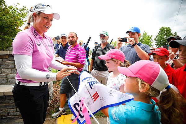 Brittany Lincicome signs autographs for fans following the second round of the PGA Tour's Barbasol Championship on Saturday at Keene Trace Golf Club in Nicholasville, Ky.