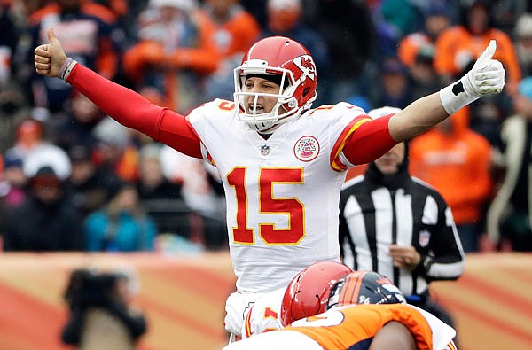 In this Dec. 31, 2017, file photo, Chiefs quarterback Patrick Mahomes signals against the Broncos during the first half of a game in Denver.