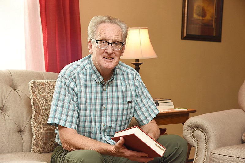 Mike Hoey poses for a photo at his home in Jefferson City