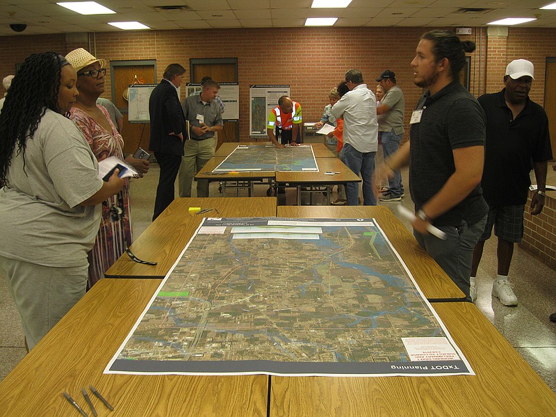 Area residents and business owners gather Tuesday at the first open-house public meeting held by the Texas Department of Transportation in Queen City, Texas. The meeting focused on plans to upgrade a 25-mile stretch of U.S. Highway 59 to Interstate 369. 