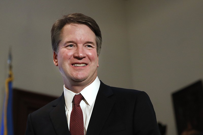 In this July 26, 2018, photo, Supreme Court nominee Judge Brett Kavanaugh meets with Sen. Jim Inhofe, R-Okla., on Capitol Hill in Washington. More than a decade after he served as what’s been called the president’s “inbox and outbox,” Kavanaugh’s role as White House staff secretary to President George W. Bush has become a flashpoint as Republicans push his confirmation to the Supreme Court. (AP Photo/Jacquelyn Martin)