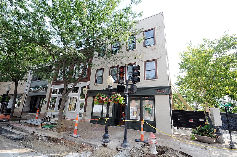 Barricades and roadwork on East High and Madison shut down the intersection to traffic in front of the law office building suffering a partial collapse.