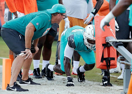 Dolphins defensive end Charles Harris works during a drill Wednesday at the team's training camp in Davie, Fla.