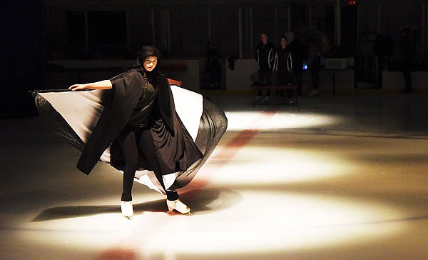 Emma Kimchi twirls as she skates during the opening number of the 56th annual Ice Show in Washington Park Ice Arena. 