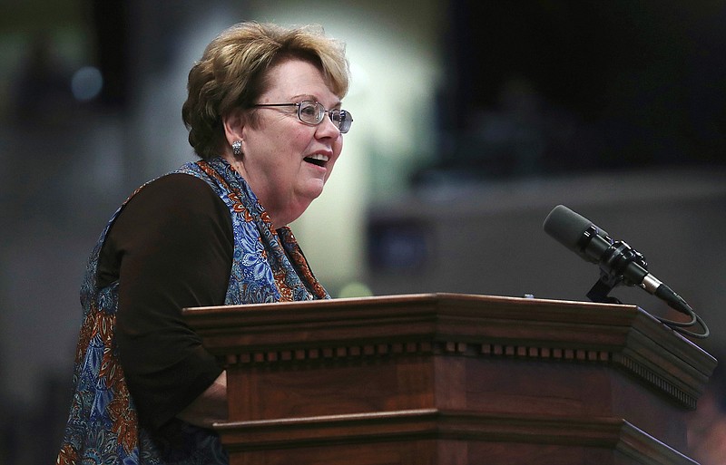 In this undated photo, President Teresa A. Sullivan addresses the crowd after receiving the class gift in John Paul Jones arena during the Valedictory Exercises for the University of Virginia in Charlottesville, Va. Sullivan's books are still on their shelves at her Madison Hall office at the University of Virginia. She hasn't yet taken down teaching awards or decided which papers will stay in Charlottesville and which will go with her on a sabbatical to the University of Texas. (Zack Wajsgras/The Daily Progress via AP)