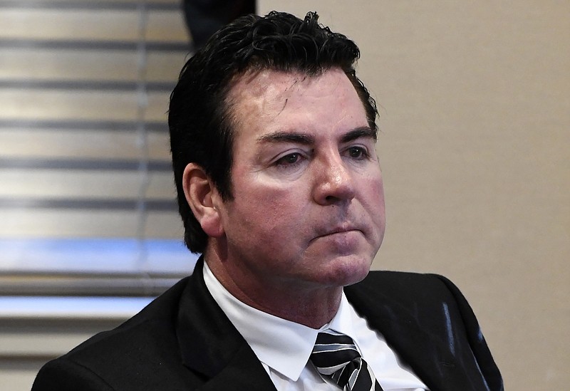 FILE - In this Wednesday, Oct. 18, 2017, file photo, Papa John's founder and CEO John Schnatter attends a meeting in Louisville, Ky. Schnatter says the pizza chain needs him back as its public face, and that it was a mistake for the company to scrub him from its marketing materials after he acknowledged using a racial slur last month.  (AP Photo/Timothy D. Easley, File)