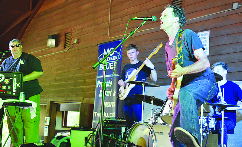 Ben Green of Griff 'n Greens belts out lyrics during the band's set at Blue Sunday, the annual Mo Blues Association fundraiser, at Memorial Park.