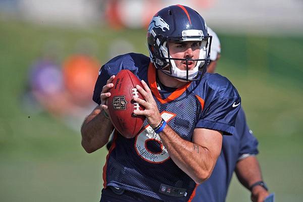 Broncos quarterback Chad Kelly takes part in drills at the team's headquarters during training camp Saturday in Englewood, Colo.