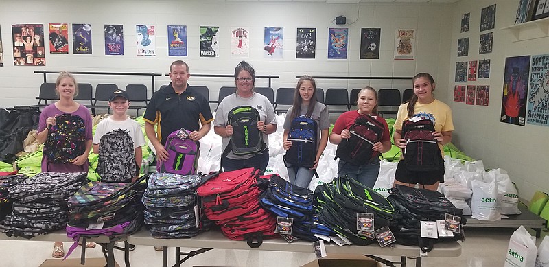 Volunteers give out school supplies July 31, 2018, at the Moniteau County Back To School Fair.