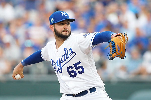 Royals starting pitcher Jakob Junis throws to a Cubs batter in the first inning of Monday night's game at Kauffman Stadium in Kansas City.