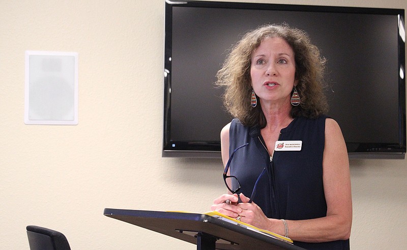  Ina McDowell, executive director of Main Street Texarkana, speaks during a meeting of the Joint Texarkana Community Committee on Tuesday, Aug. 7, 2018, at the offices of Ark-Tex Council of Governments in Texarkana, Texas. The meeting's theme was local treasures and McDowell spoke about downtown revitalization.
