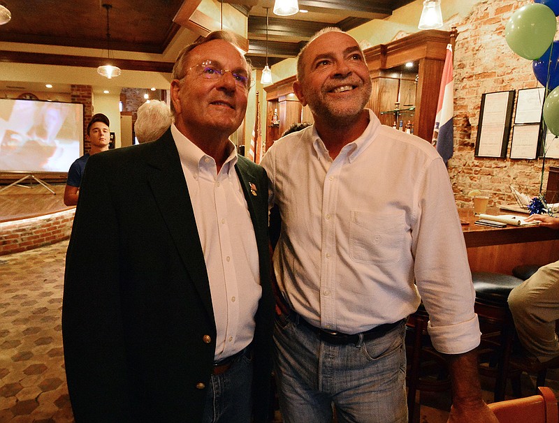 Dave Griffith, left, and Ralph Bray await voting results during a watch party Tuesday evening.