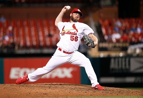 In this June 26 file photo, Cardinals relief pitcher Greg Holland throws during the eighth inning of a game against the Indians in St. Louis. The Nationals have signed Holland, whom they hope can regain his effectiveness and provide leadership in the clubhouse. Holland was 0-2 with a 7.92 ERA in 32 games with St. Louis before being designated for assignment July 27.